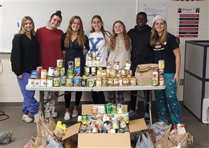 NHS Students with donated food for community